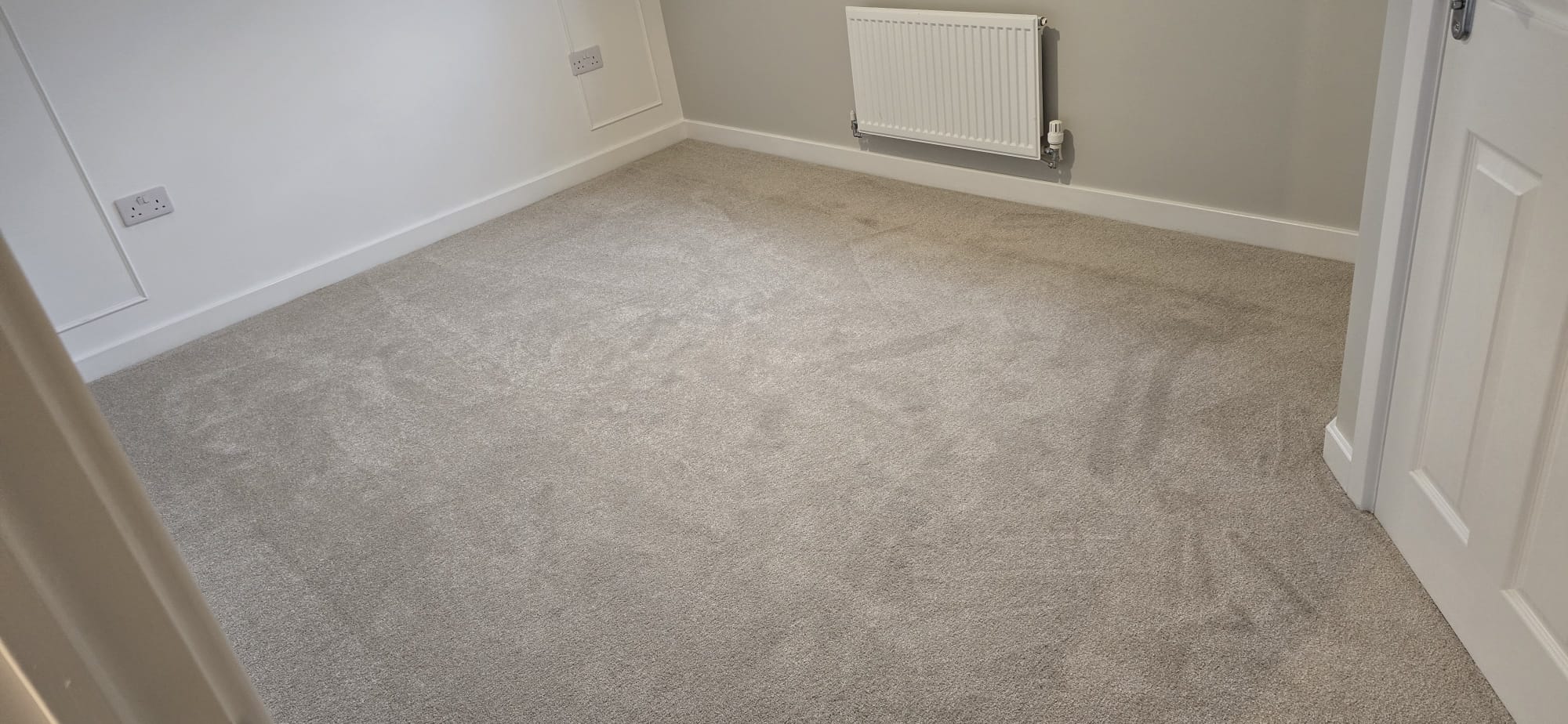 Beige twist carpet fitted in a bedroom in Northampton