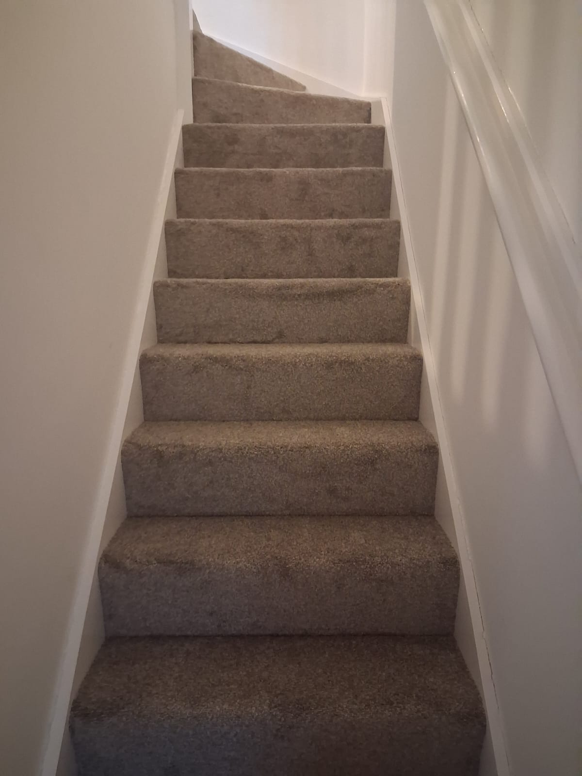 Beige twist carpet fitted to a narrow staircase in a home in Northampton
