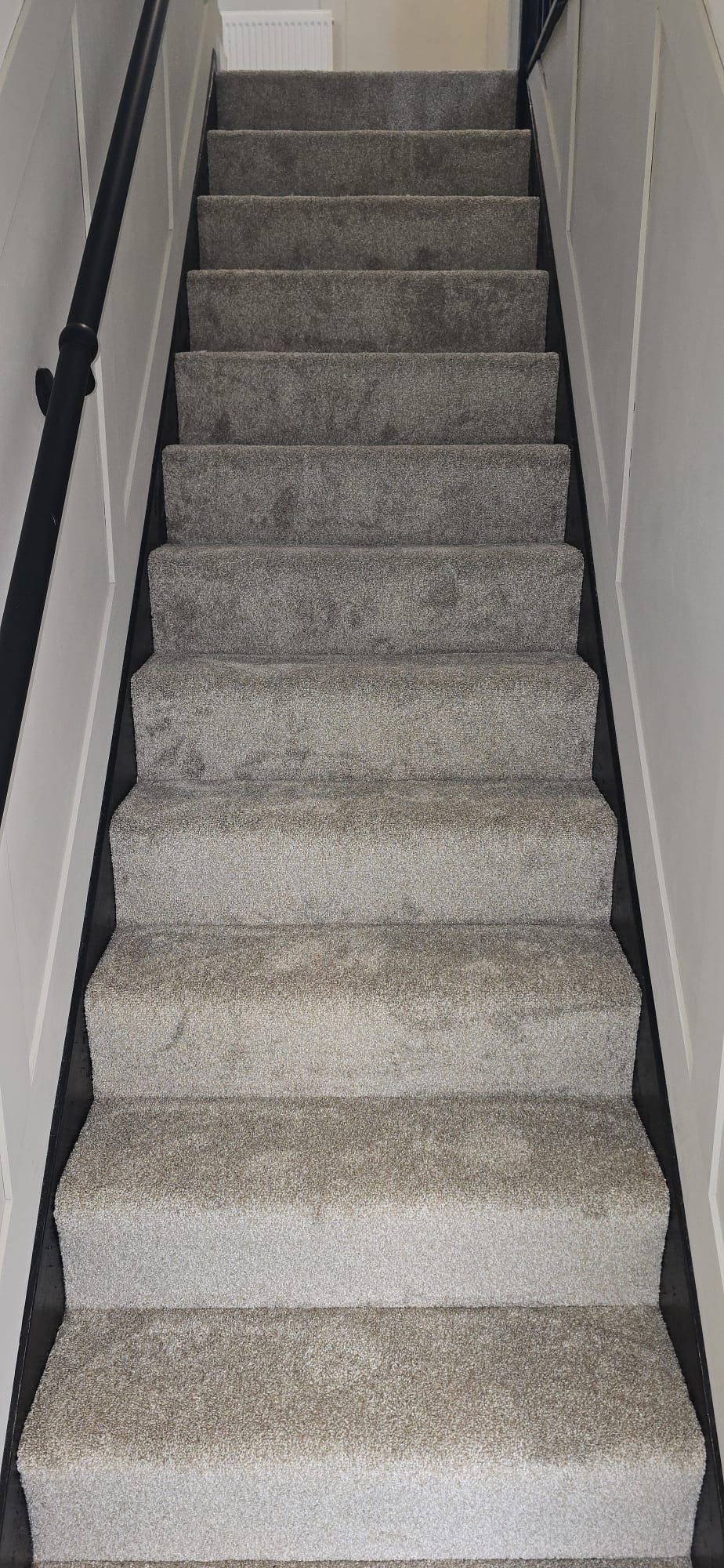 Grey twist carpet fitted to a staircase in a home in Northampton