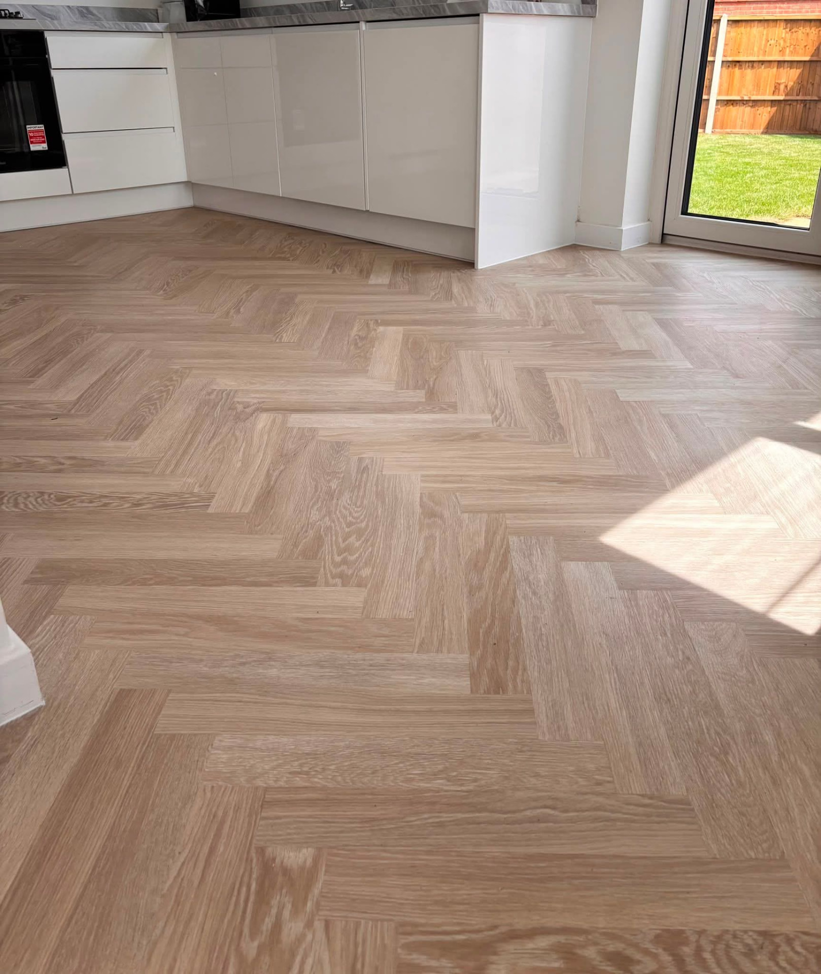 Herringbone LVT flooring fitted in a kitchen in Daventry